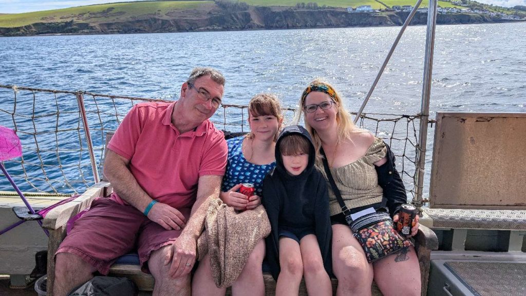 The four members of the Till family sat on a boat out at sea